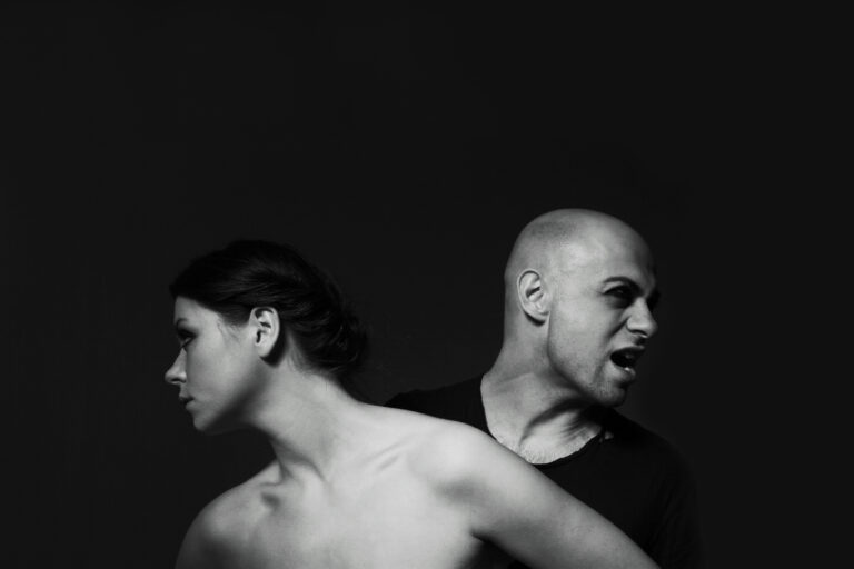 couple-posing-dark-background